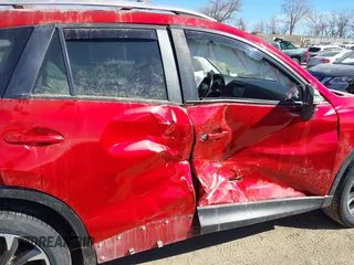 2016 Mazda CX-5 Grand Touring with VIN JM3KE4DY0G0709563, listed as a IAAI auction lot 41886956 with 156,769 mi miles. Bid and sale history available at carsss.com. Image 6.