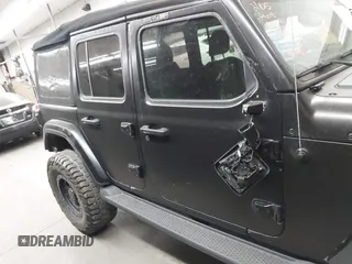 2018 Jeep Wrangler Unlimited Sahara z VIN 1C4HJXEN6JW294774, wystawiony jako IAAI lot #41573606 z przebiegiem 49 325 mil mil oraz . Historia ofert i sprzedaży dostępna na DreamBid. Obrazek 14.