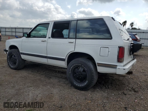 1994 GMC Jimmy Diamond Edition Luxury z VIN 1GKDT13W5R2503916, wystawiony jako Copart lot #54717215 z przebiegiem 99 991 mil mil oraz Szkoda całkowita • Salvage title. Historia ofert i sprzedaży dostępna na DreamBid. Obrazek 2.