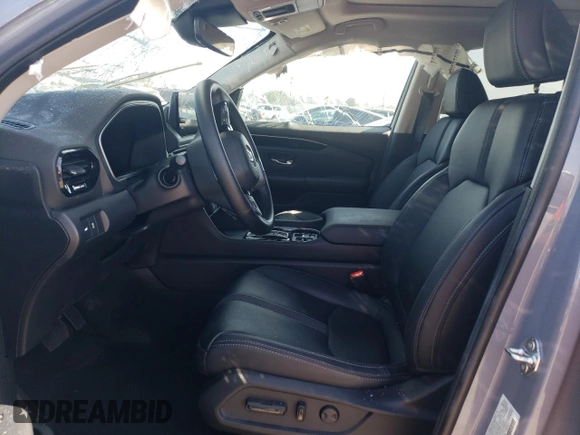 2023 Honda Pilot Touring with VIN 5FNYG2H7XPB011420, listed as a Copart auction lot 69799314 with 9,601 mi miles and Salvage Title. Bid and sale history available at DreamBid. Image 7.