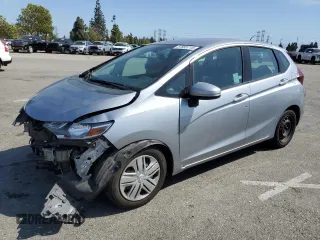 2019 Honda Fit LX z VIN 3HGGK5H44KM711733, wystawiony jako Copart lot #57655715 z przebiegiem 65 099 mil mil oraz Szkoda całkowita • Salvage title. Historia ofert i sprzedaży dostępna na DreamBid. Obrazek 1.