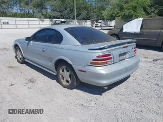 1995 Ford Mustang with VIN 1FALP4047SF170414, listed as a IAAI auction lot 42079990 with 106,398 mi miles. Bid and sale history available at carsss.com. Image 3.