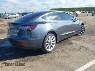 2018 Tesla Model 3 Long Range Battery with VIN 5YJ3E1EA4JF006036, listed as a IAAI auction lot 41934680 with 115,649 mi miles and . Bid and sale history available at DreamBid. Image 4.