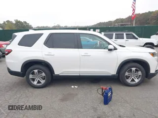 2023 Honda Pilot EX-L with VIN 5FNYG1H58PB016138, listed as a IAAI auction lot 40591717 with 10,068 mi miles and . Bid and sale history available at DreamBid. Image 13.