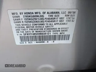 2009 Honda Pilot EX-L with VIN 5FNYF48559B034121, listed as a IAAI auction lot 41928138 with 193,969 mi miles. Bid and sale history available at carsss.com. Image 9.