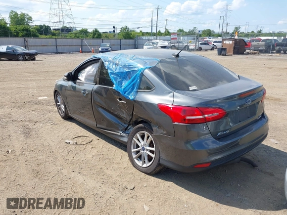 2016 Ford Focus SE with VIN 1FADP3F23GL392347, listed as a IAAI auction lot 39951722 with 143,679 mi miles. Bid and sale history available at carsss.com. Image 3.