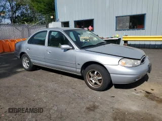1998 Ford Contour LX with VIN 1FAFP66L2WK290948, listed as a Copart auction lot 56204295 with 76,307 mi miles and Salvage title. Bid and sale history available at DreamBid. Image 4.