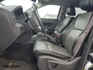 2010 Jeep Grand Cherokee Laredo with VIN 1J4RR4GT7AC120604, listed as a Copart auction lot 84257724 with 60,827 mi miles and Salvage Title. Bid and sale history available at carsss.com. Image 7.