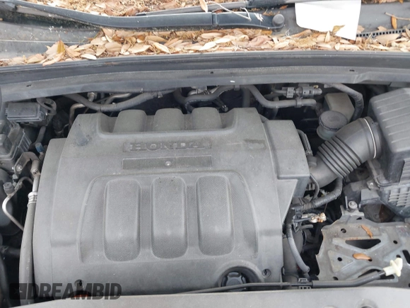 2005 Honda Odyssey TOURING with VIN 5FNRL38815B027811, listed as a IAAI auction lot 42105642 with 303,913 mi miles. Bid and sale history available at carsss.com. Image 10.