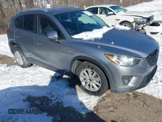 2013 Mazda CX-5 Touring with VIN JM3KE2CE7D0129623, listed as a IAAI auction lot 41344623 with 147,025 mi miles. Bid and sale history available at carsss.com. Image 1.