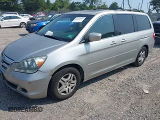 2005 Honda Odyssey EX-L z VIN 5FNRL38785B036142, wystawiony jako IAAI lot #42422595 z przebiegiem 190 083 mil mil oraz . Historia ofert i sprzedaży dostępna na DreamBid. Obrazek 2.