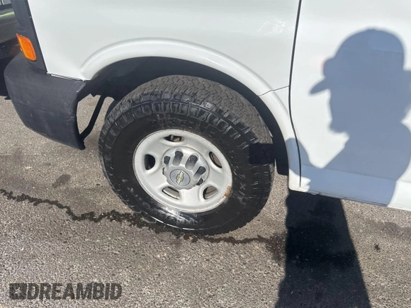 2014 Chevrolet Express Cargo with VIN 1GCWGFCA8E1121812, listed as a IAAI auction lot 42801147 with 128,506 mi miles and . Bid and sale history available at DreamBid. Image 18.