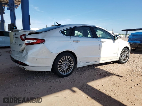 2013 Ford Fusion Titanium Hybrid z VIN 3FA6P0RUXDR376633, wystawiony jako Copart lot #57685555 z przebiegiem 133 248 mil mil oraz Szkoda całkowita • Salvage title. Historia ofert i sprzedaży dostępna na DreamBid. Obrazek 3.