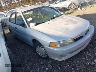 1999 Mitsubishi Mirage DE z VIN JA3AY26A9XU053984, wystawiony jako IAAI lot #42136918 z przebiegiem Nie podano mil oraz . Historia ofert i sprzedaży dostępna na DreamBid. Obrazek 1.