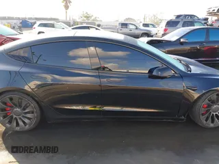 2022 Tesla Model 3 Performance z VIN 5YJ3E1EC7NF137744, wystawiony jako IAAI lot #41427701 z przebiegiem Nie podano mil oraz . Historia ofert i sprzedaży dostępna na DreamBid. Obrazek 12.
