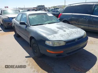 1994 Toyota Camry LE z VIN 4T1SK12E3RU418412, wystawiony jako IAAI lot #42160975 z przebiegiem 254 710 mil mil oraz . Historia ofert i sprzedaży dostępna na DreamBid. Obrazek 1.