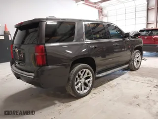 2015 Chevrolet Tahoe LTZ with VIN 1GNSCCKC2FR114442, listed as a IAAI auction lot 41629816 with 152,768 mi miles. Bid and sale history available at carsss.com. Image 4.