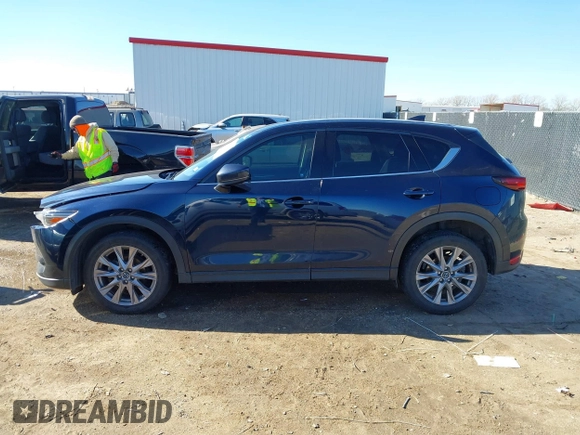 2019 Mazda CX-5 Grand Touring with VIN JM3KFBDM2K1685168, listed as a IAAI auction lot 41323598 with 88,429 mi miles. Bid and sale history available at carsss.com. Image 14.