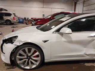 2018 Tesla Model 3 Long Range Battery with VIN 5YJ3E1EB5JF084446, listed as a IAAI auction lot 41209852 with 70,125 mi miles and . Bid and sale history available at DreamBid. Image 20.