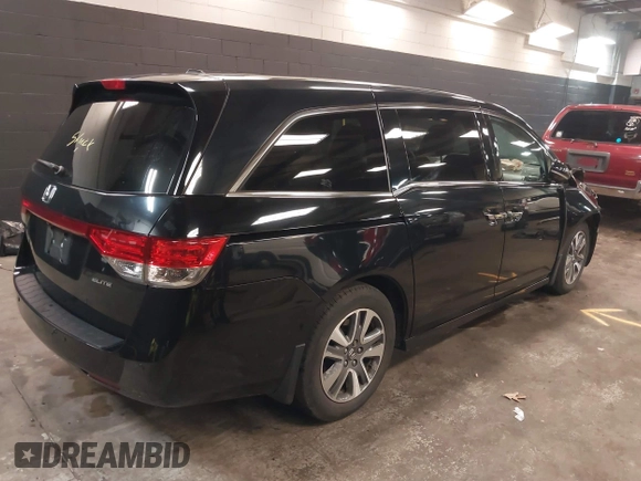 2014 Honda Odyssey Touring with VIN 5FNRL5H94EB105745, listed as a IAAI auction lot 41744012 with 77,032 mi miles and . Bid and sale history available at DreamBid. Image 4.