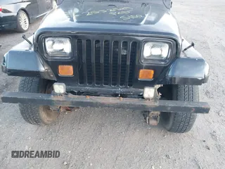 1990 Jeep Wrangler with VIN 2J4FY29T2LJ543655, listed as a IAAI auction lot 41766772 with 999,999 mi miles. Bid and sale history available at carsss.com. Image 6.