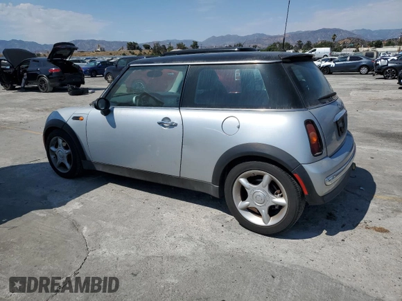 2003 MINI Hardtop with VIN WMWRC33453TE14909, listed as a Copart auction lot 65419725 with 111,960 mi miles and Salvage title. Bid and sale history available at DreamBid. Image 2.
