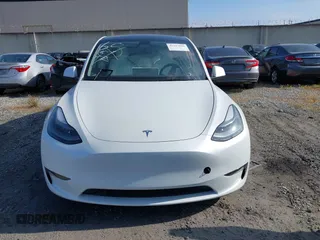 2024 Tesla Model Y with VIN 7SAYGDED2RF017448, listed as a IAAI auction lot 41597056 with 9,702 mi miles and . Bid and sale history available at DreamBid. Image 12.