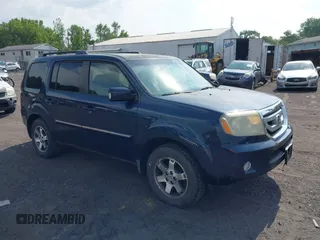 2010 Honda Pilot Touring z VIN 5FNYF4H96AB012670, wystawiony jako IAAI lot #42664237 z przebiegiem 243 754 mil mil oraz . Historia ofert i sprzedaży dostępna na DreamBid. Obrazek 1.