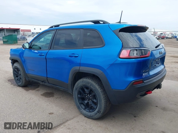 2022 Jeep Cherokee Trailhawk z VIN 1C4PJMBX4ND513488, wystawiony jako IAAI lot #42137114 z przebiegiem 12 306 mil mil oraz . Historia ofert i sprzedaży dostępna na DreamBid. Obrazek 3.