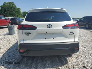 2023 Toyota Corolla Cross Hybrid S with VIN 7MUFBABG5PV008595, listed as a Copart auction lot 60002585 with 9,052 mi miles and Salvage title. Bid and sale history available at DreamBid. Image 6.