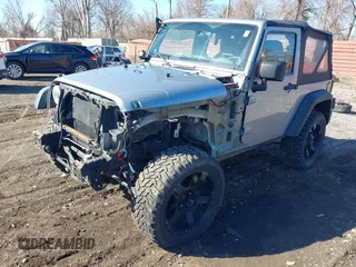2013 Jeep Wrangler Sport with VIN 1C4AJWAG1DL595509, listed as a IAAI auction lot 41814406 with 59,263 mi miles and . Bid and sale history available at DreamBid. Image 2.