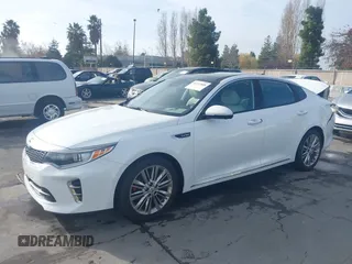 2016 Kia Optima SXL Turbo with VIN 5XXGV4L20GG074869, listed as a IAAI auction lot 41212808 with 82,884 mi miles. Bid and sale history available at carsss.com. Image 2.