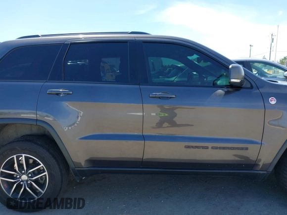 2017 Jeep Grand Cherokee Trailhawk with VIN 1C4RJFLG3HC877110, listed as a IAAI auction lot 42276506 with 144,993 mi miles and . Bid and sale history available at DreamBid. Image 14.