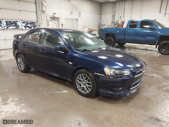 2013 Mitsubishi Lancer SE with VIN JA32V2FW9DU005616, listed as a IAAI auction lot 41247087 with 129,055 mi miles. Bid and sale history available at carsss.com. Image 1.