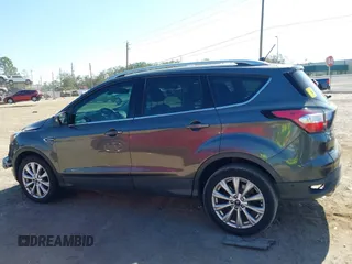 2018 Ford Escape Titanium with VIN 1FMCU0J99JUB09562, listed as a IAAI auction lot 41547659 with 63,700 mi miles and . Bid and sale history available at DreamBid. Image 14.