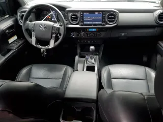 2020 Toyota Tacoma SR5 with VIN 3TMDZ5BN2LM097782, listed as a Copart auction lot 61573465 with 57,321 mi miles and Salvage title. Bid and sale history available at DreamBid. Image 8.