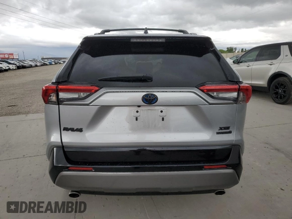 2021 Toyota RAV4 Hybrid XSE with VIN 4T3E6RFV2MU016441, listed as a Copart auction lot 57090975 with 69,304 mi miles and Salvage title. Bid and sale history available at DreamBid. Image 6.