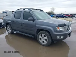 2014 Honda Ridgeline RTL with VIN 5FPYK1F50EB002577, listed as a IAAI auction lot 41931258 with 147,665 mi miles. Bid and sale history available at carsss.com. Image 1.