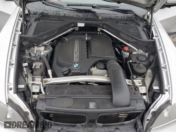 2012 BMW X5 35i with VIN 5UXZV4C57CL747717, listed as a Copart auction lot 63003135 with 135,999 mi miles and Clean title. Bid and sale history available at DreamBid. Image 12.