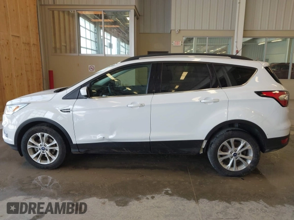 2017 Ford Escape SE z VIN 1FMCU0GD3HUC12658, wystawiony jako IAAI lot #41801033 z przebiegiem 107 662 mil mil oraz . Historia ofert i sprzedaży dostępna na DreamBid. Obrazek 14.