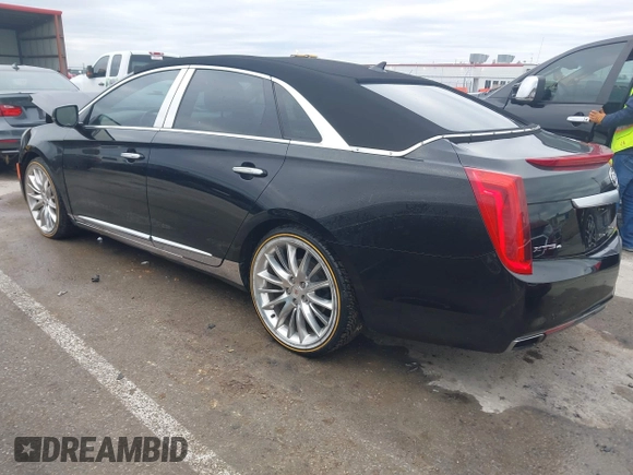 2013 Cadillac XTS Platinum z VIN 2G61V5S37D9194227, wystawiony jako IAAI lot #41510449 z przebiegiem 114 243 mil mil oraz . Historia ofert i sprzedaży dostępna na DreamBid. Obrazek 3.