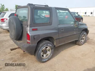 1997 Chevrolet Tracker z VIN 2CNBJ1863V6906951, wystawiony jako IAAI lot #42400087 z przebiegiem 209 563 mil mil oraz . Historia ofert i sprzedaży dostępna na DreamBid. Obrazek 4.