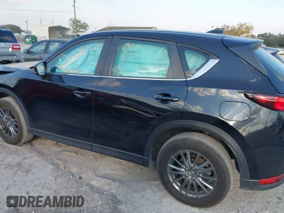 2019 Mazda CX-5 Sport with VIN JM3KFABMXK0693540, listed as a IAAI auction lot 41523569 with 57,895 mi miles and . Bid and sale history available at DreamBid. Image 3.