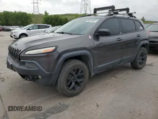 2014 Jeep Cherokee Trailhawk z VIN 1C4PJMBS0EW258170, wystawiony jako Copart lot #59561505 z przebiegiem 232 754 mil mil oraz Szkoda całkowita • Salvage title. Historia ofert i sprzedaży dostępna na DreamBid. Obrazek 1.