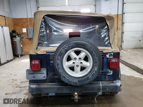 2000 Jeep Wrangler SE with VIN 1J4FA29P1YP739555, listed as a Copart auction lot 58501025 with 128,458 mi miles and Clean title. Bid and sale history available at DreamBid. Image 6.