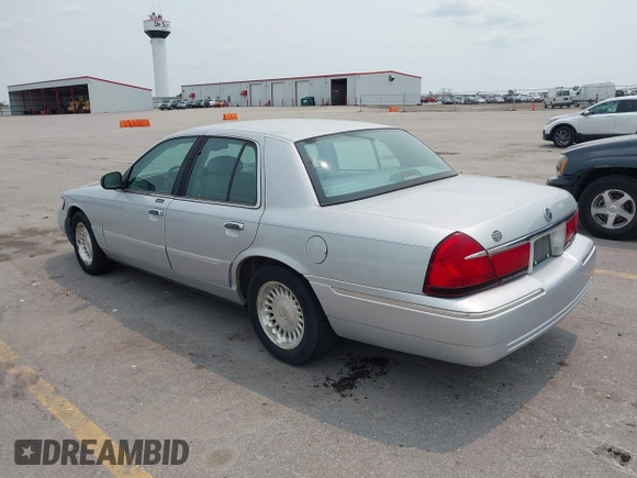 1999 Mercury Grand Marquis LS z VIN 2MEFM75W7XX659031, wystawiony jako IAAI lot #42362387 z przebiegiem 140 067 mil mil oraz . Historia ofert i sprzedaży dostępna na DreamBid. Obrazek 3.