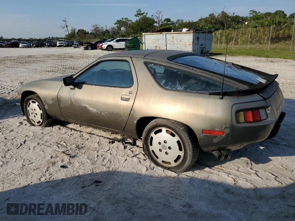 1984 Porsche 928 z VIN WP0JB0927ES862274, wystawiony jako Copart lot #75285934 z przebiegiem 97 509 mil mil oraz Czysty tytuł • Clean title. Historia ofert i sprzedaży dostępna na DreamBid. Obrazek 2.