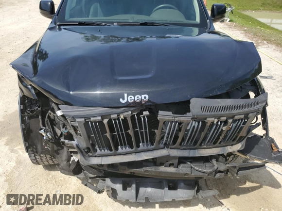 2013 Jeep Grand Cherokee Laredo with VIN 1C4RJEAG2DC519570, listed as a Copart auction lot 52066225 with 129,091 mi miles and Salvage Title. Bid and sale history available at carsss.com. Image 12.