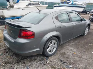 2013 Dodge Avenger SXT z VIN 1C3CDZCG0DN521540, wystawiony jako IAAI lot #40772548 z przebiegiem 145 455 mil mil oraz . Historia ofert i sprzedaży dostępna na DreamBid. Obrazek 4.