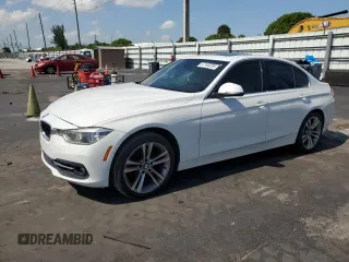 2018 BMW 3 Series 330i with VIN WBA8B9C58JEE80964, listed as a Copart auction lot 57103285 with 188,488 mi miles and Salvage title. Bid and sale history available at DreamBid. Image 1.